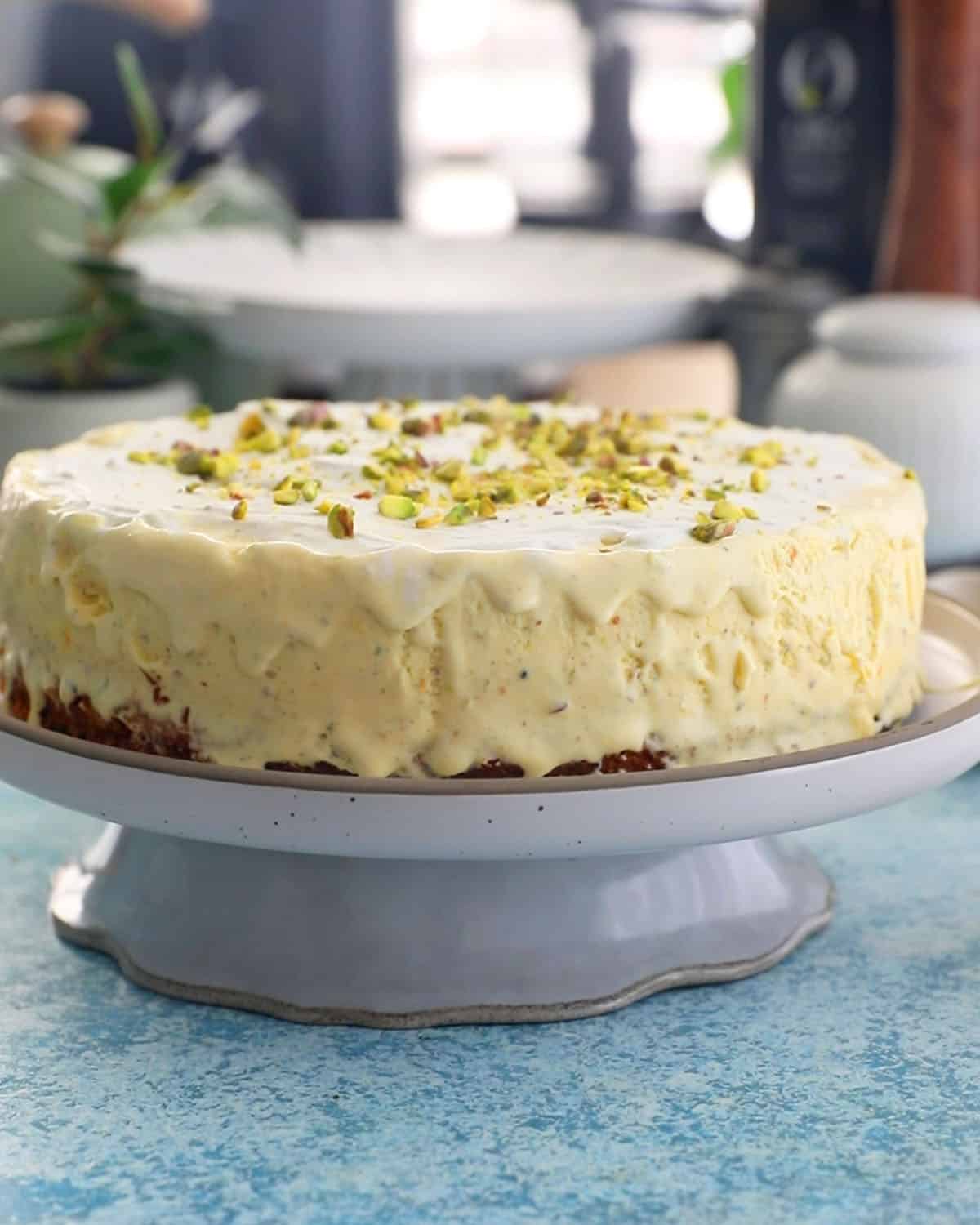 one yellow pistachio ice cream cake in a white plate.