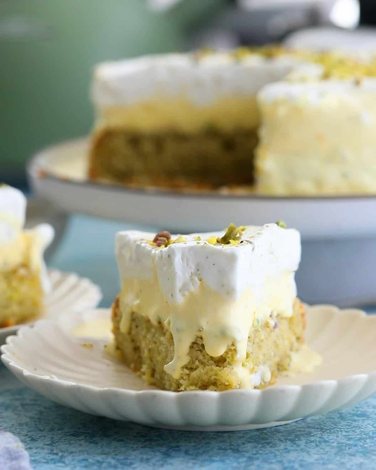 one slice of pistachio ice cream cake in a white plate.