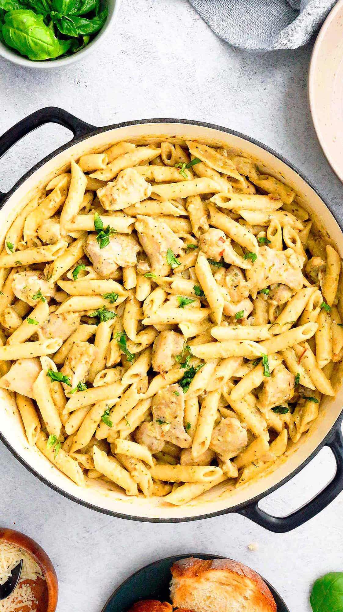 enamel skillet with cooked chicken pasta. 