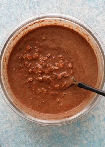 brown chocolate liquid with oats in a glass bowl.