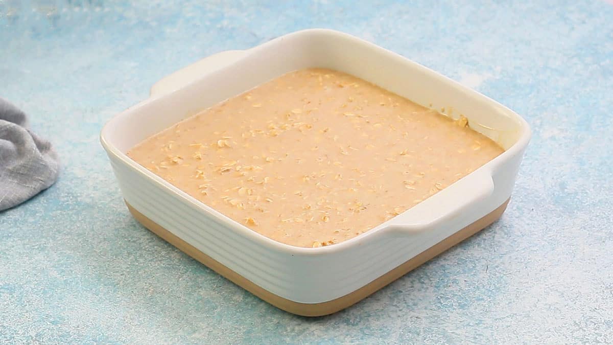 one white square baking pan with baked oatmeal mixture.