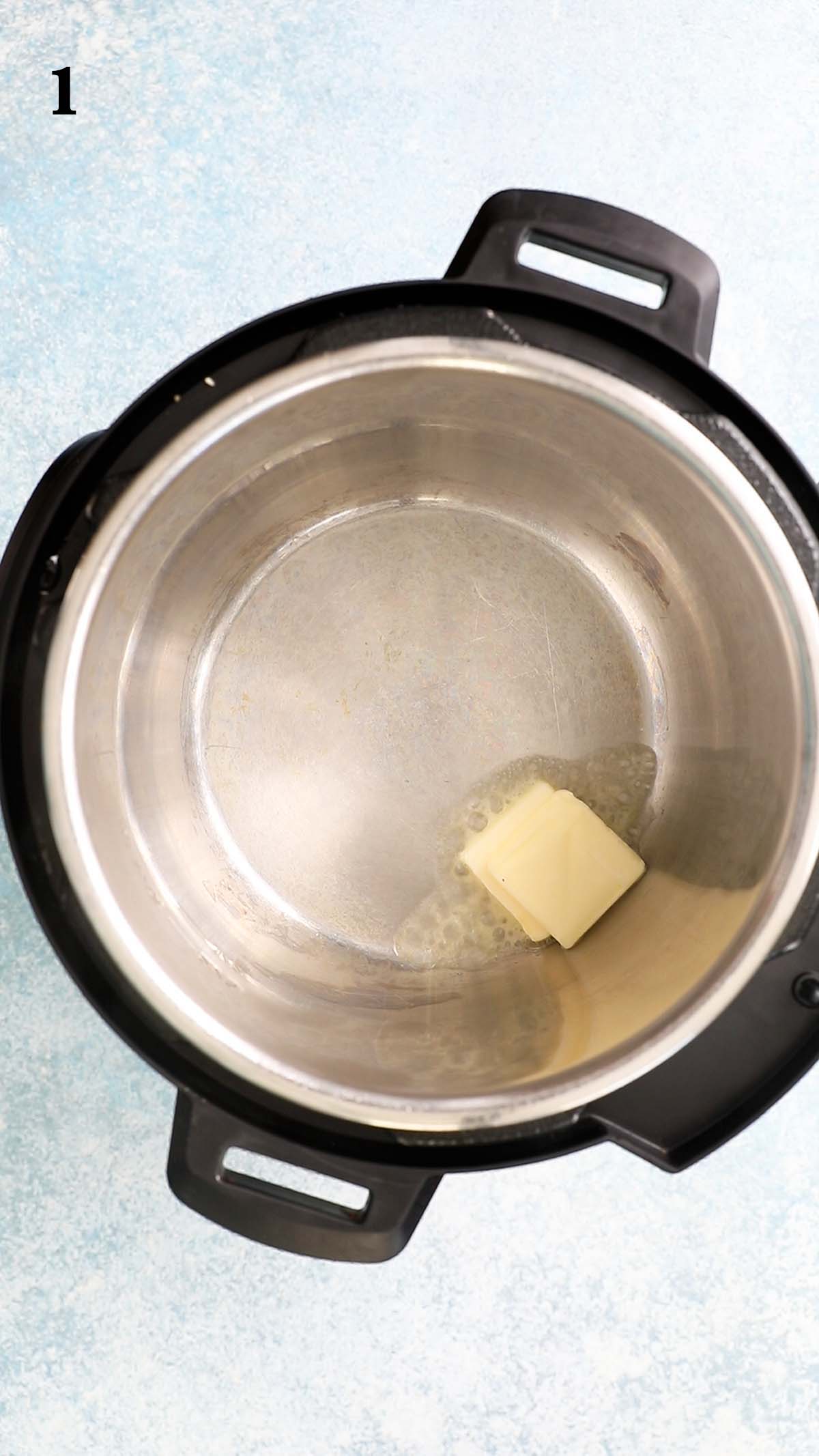 a dab of butter melting in a hot instant pot.