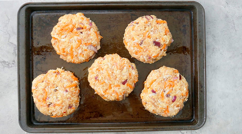 Ground chicken shaped into patties ready to be baked