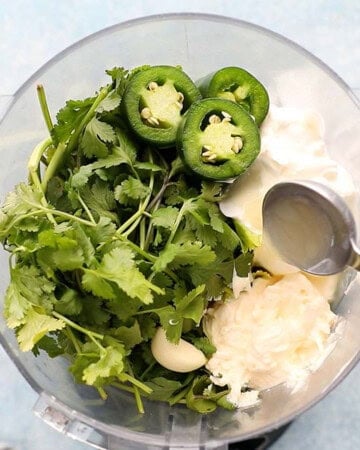 cilantro leaves, white cream and lemon juice in a food processor.
