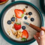 a black bowl of oatmeal cooked in instant pot.