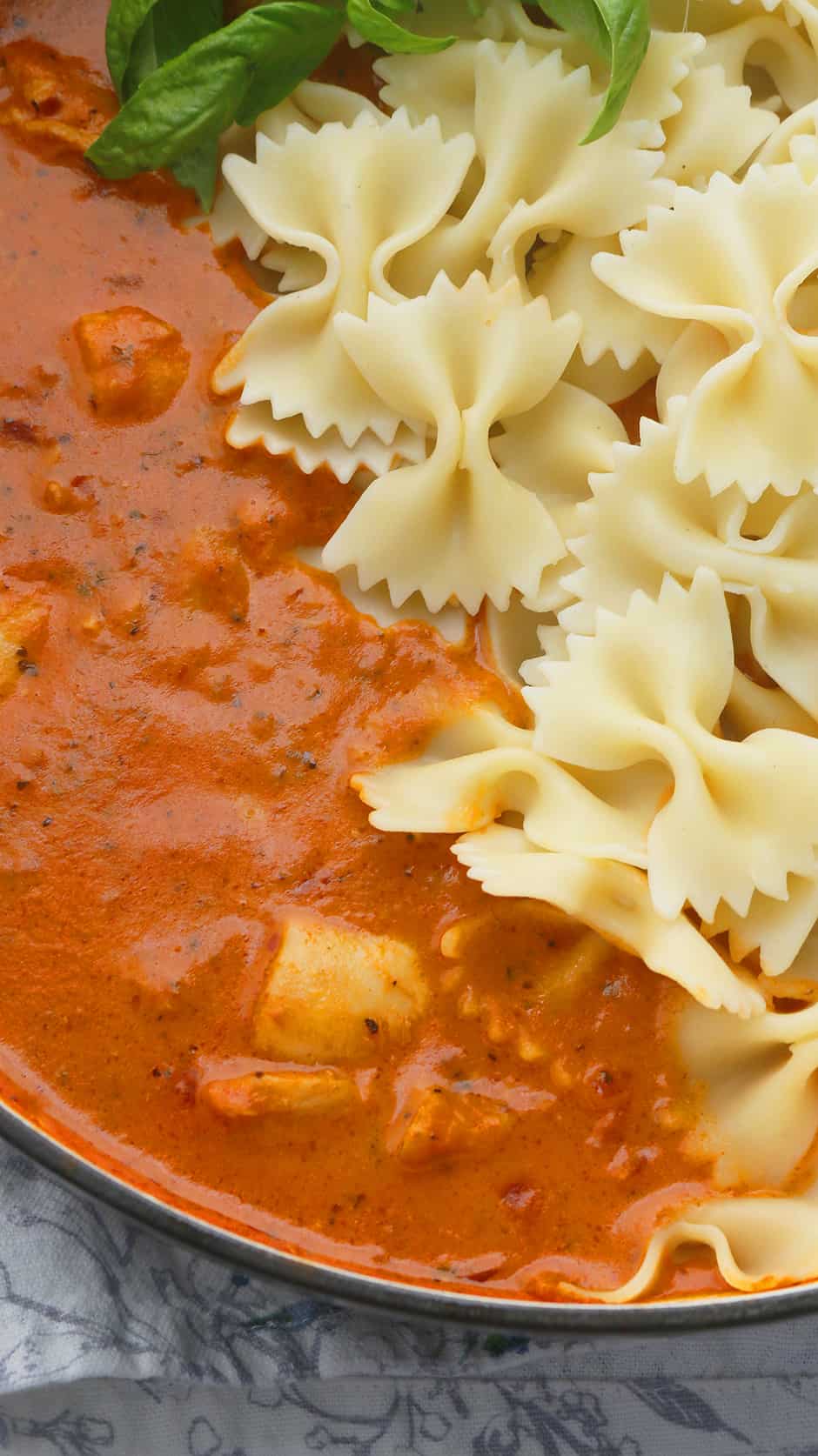 Creamy spicy tomato sauce along with bow tie pasta 