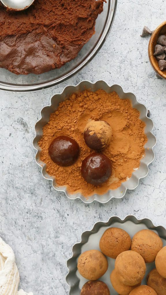 small tart with cocoa powder and 3 ingredient truffles in it for rolling
