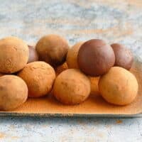 chocolate truffles placed on a steel tray.
