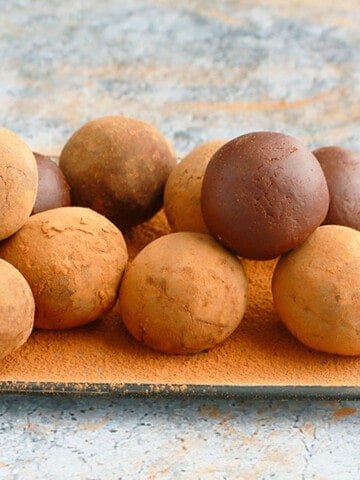 chocolate truffles placed on a steel tray.