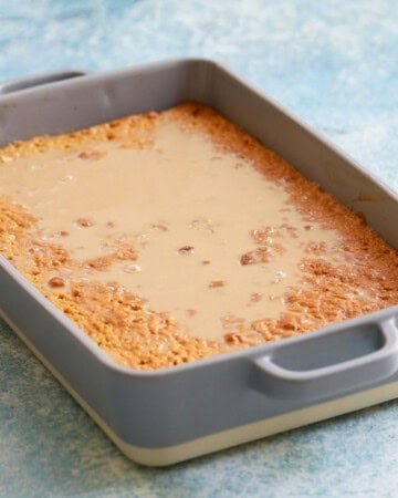 baked tres leches cake in a rectangular cake pan.