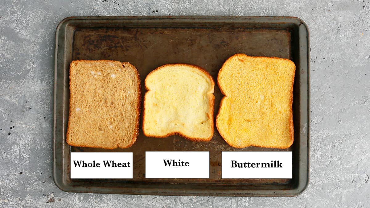 a baking sheet with different types of cooked toasts