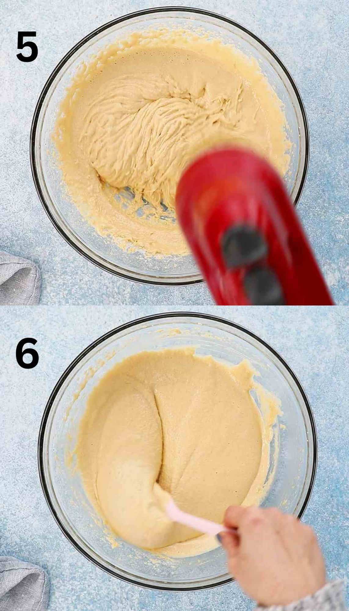 beating cake batter in a glass bowl using a red mixer.