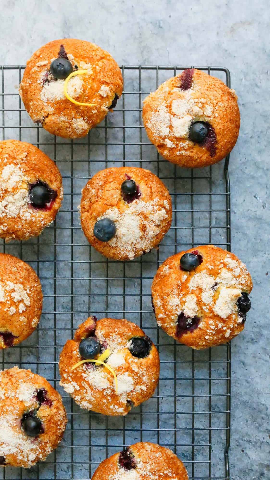 blueberry muffins placed on a wire rack