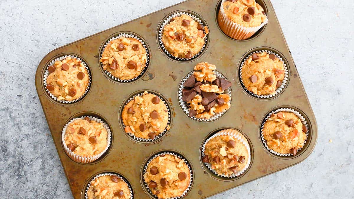 baked almond flour chocolate chip muffins in a pan. 