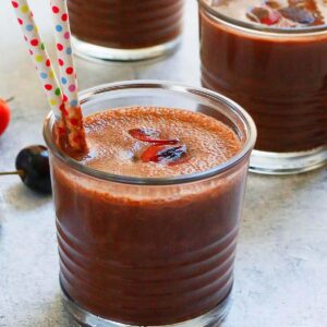 3 glasses filled with chocolate smoothie.