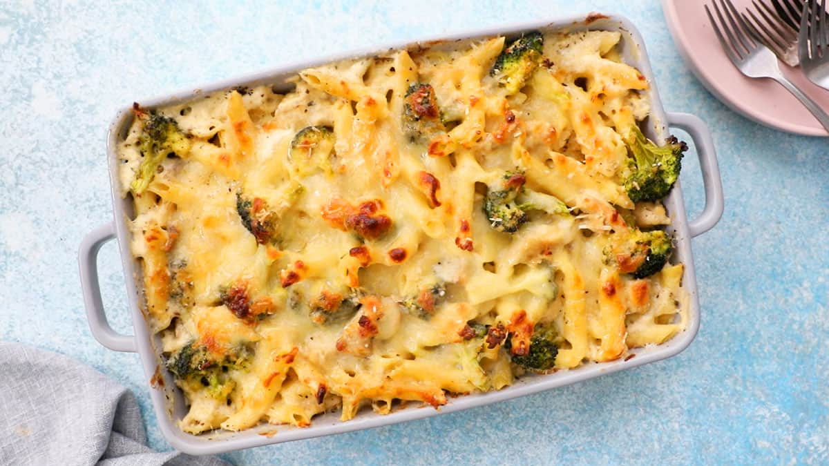 baked pasta chicken broccoli in a grey dish.