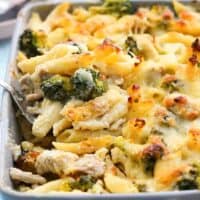 baked pasta chicken broccoli in a grey dish.