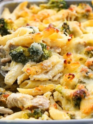 baked pasta chicken broccoli in a grey dish.