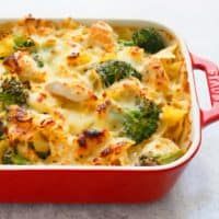 chicken broccoli pasta baked in a red pan