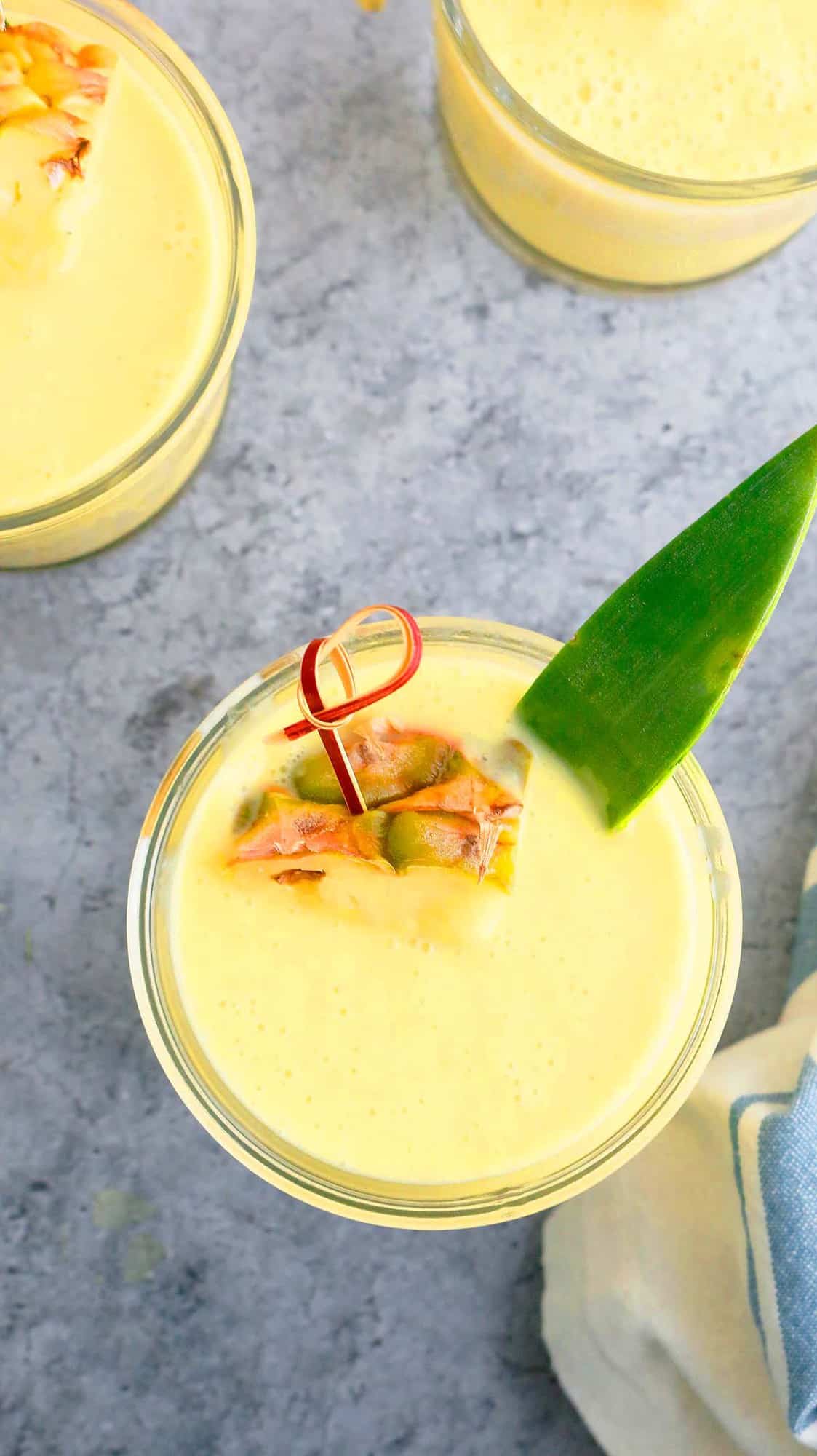 glasses filled with healthy pineapple smoothie