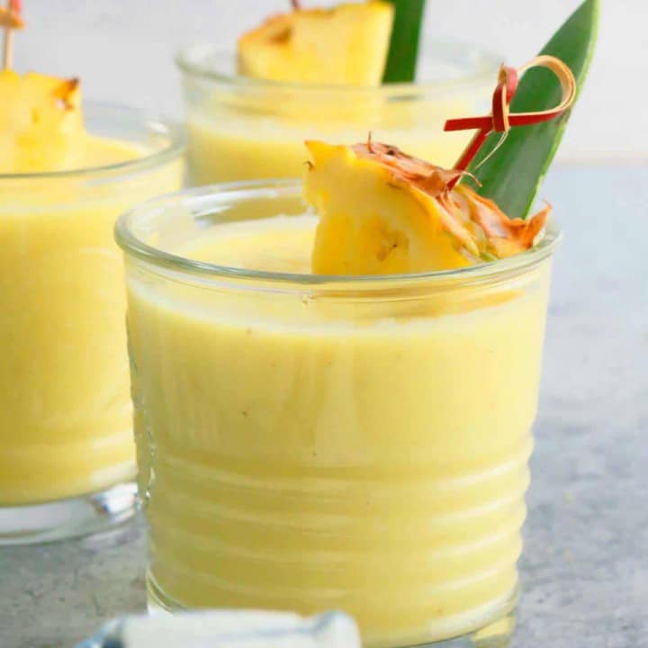 healthy pina colada smoothie in 3 glasses