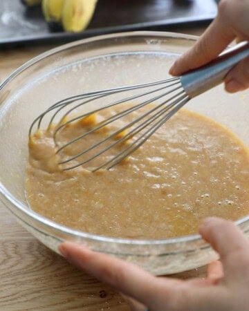 almond flour banana muffin batter in a glass bowl.