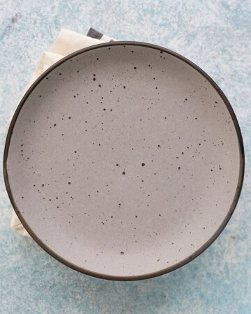 a grey plate placed on top of a pan.