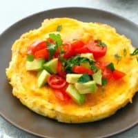 brown plate with cheesy egg omelette