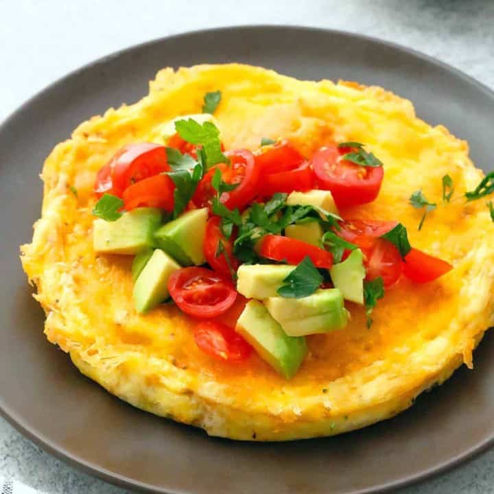 brown plate with cheesy egg omelette