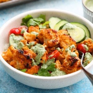 tandoori cauliflower bites in a white bowl.