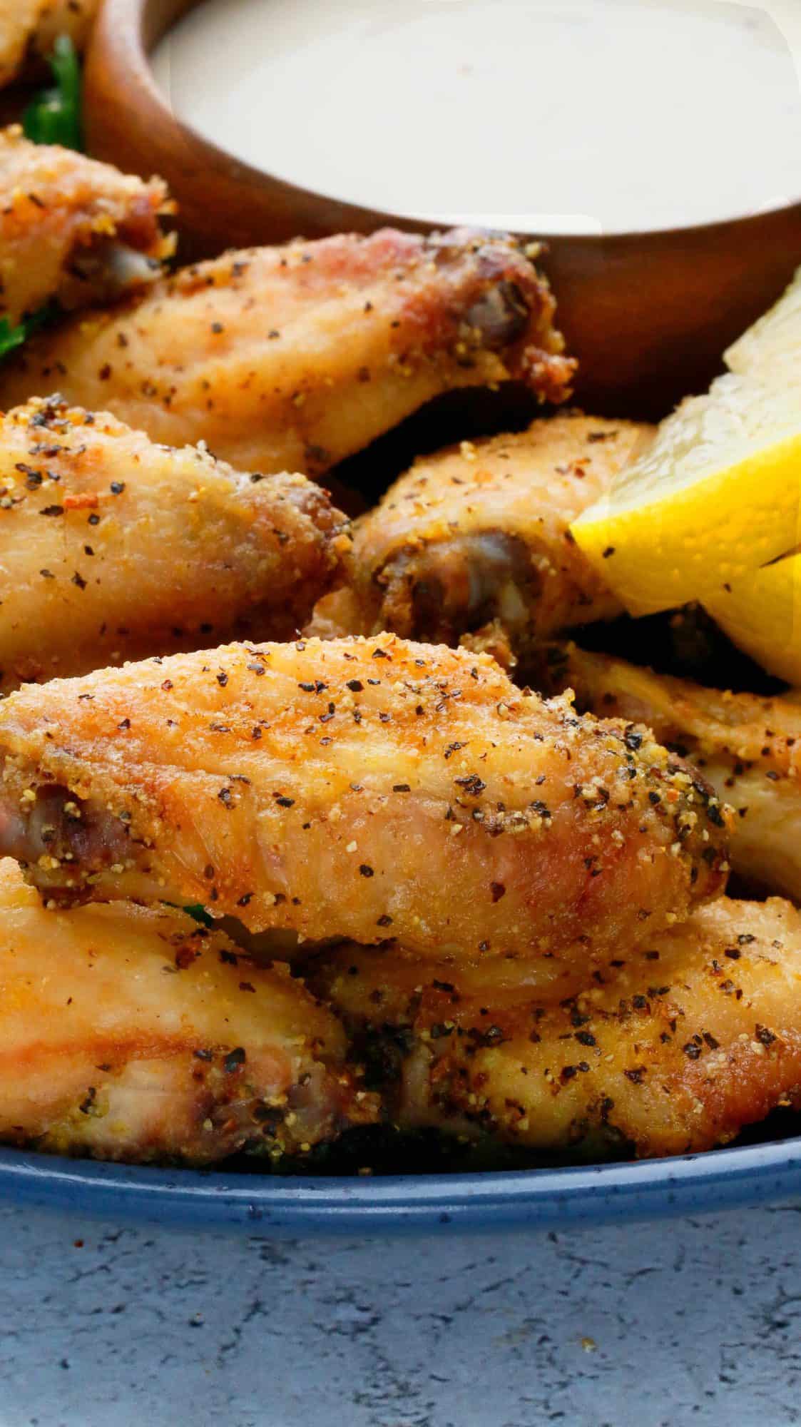 crispy chicken wings with lemon pepper seasoning.