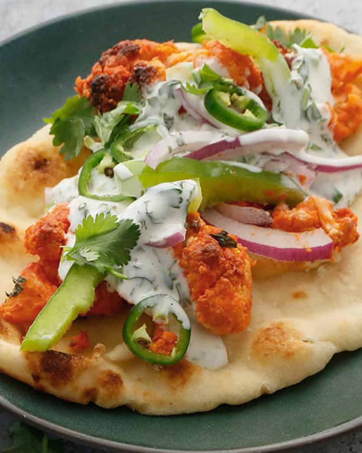 cauliflower wrap in a green plate.