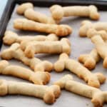 baked bone shaped cookies on a baking sheet.