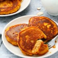 gluten free pumpkin pancakes in white plates