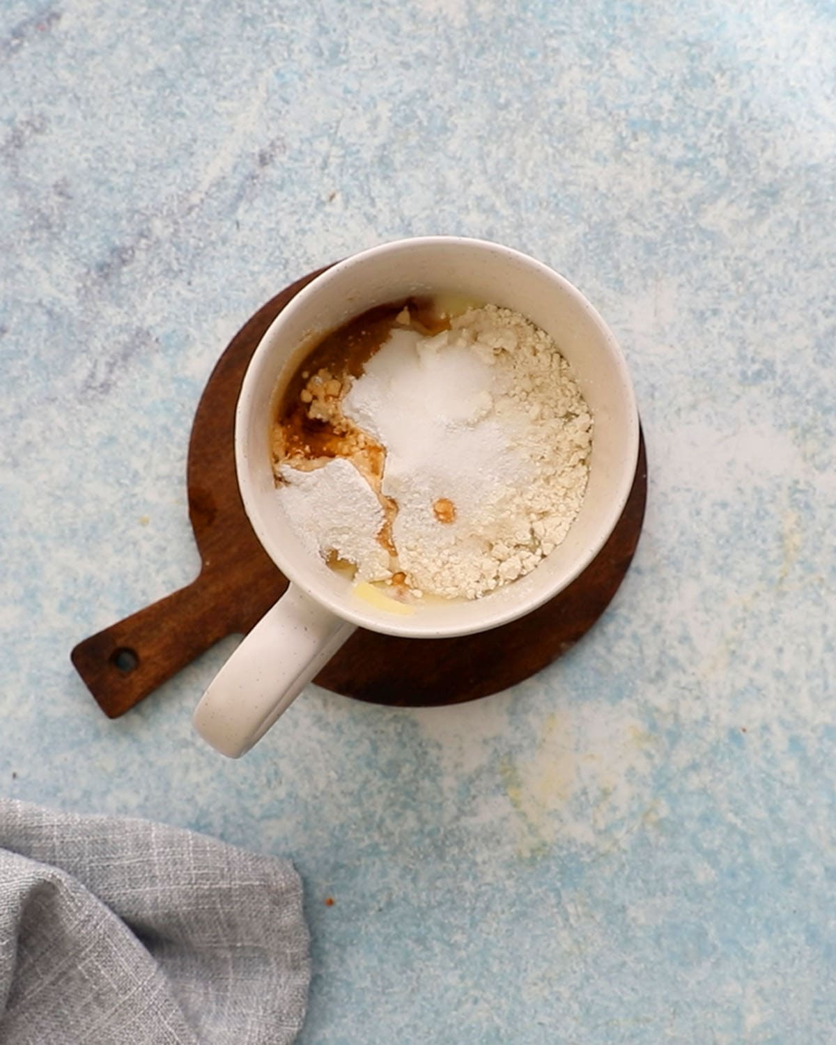 white flour mixture in a white mug.