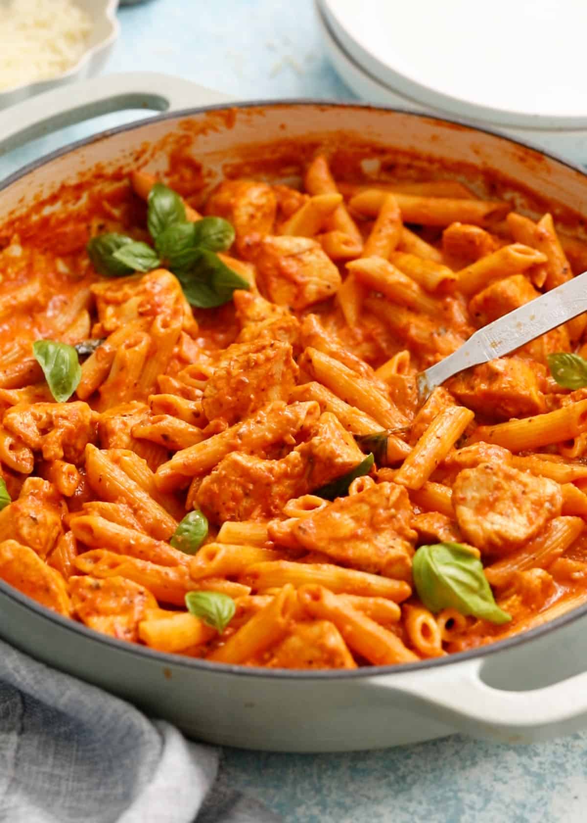 chicken vodka pasta in a white pan.
