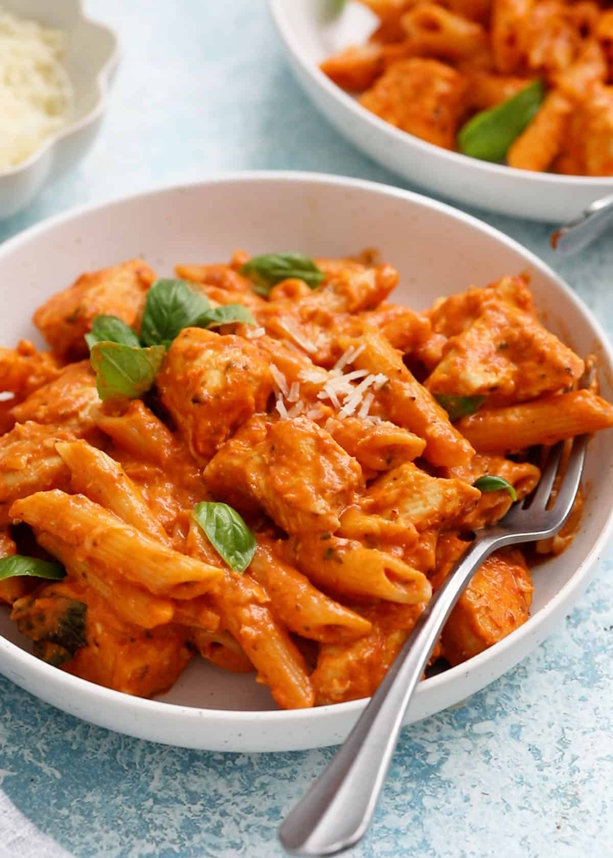 chicken vodka pasta in a white bowl.
