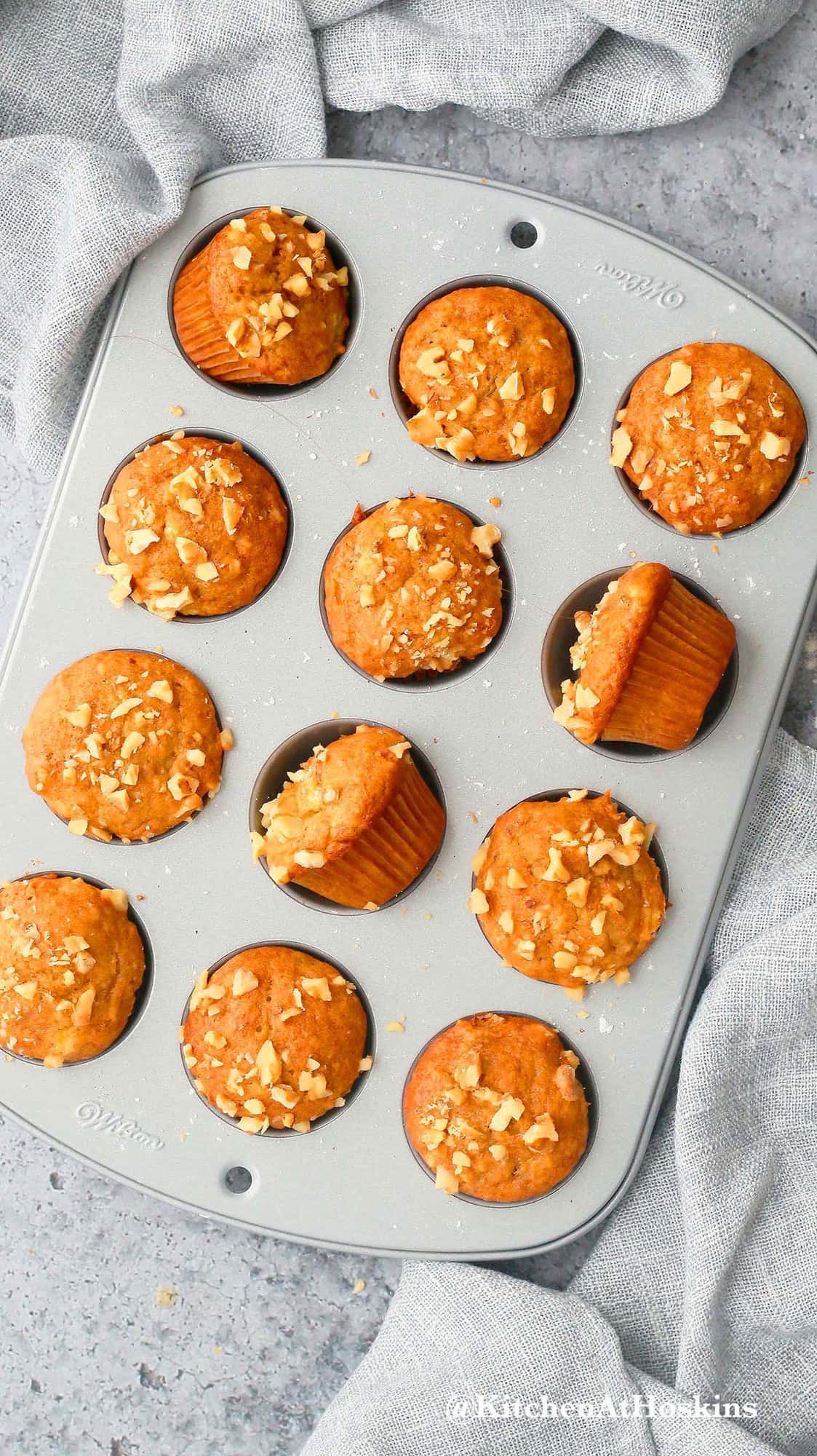 twelve cooked mini banana muffins in a tin