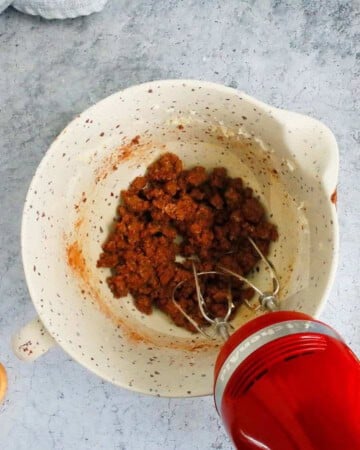 chocolate cookie dough in a white cup.