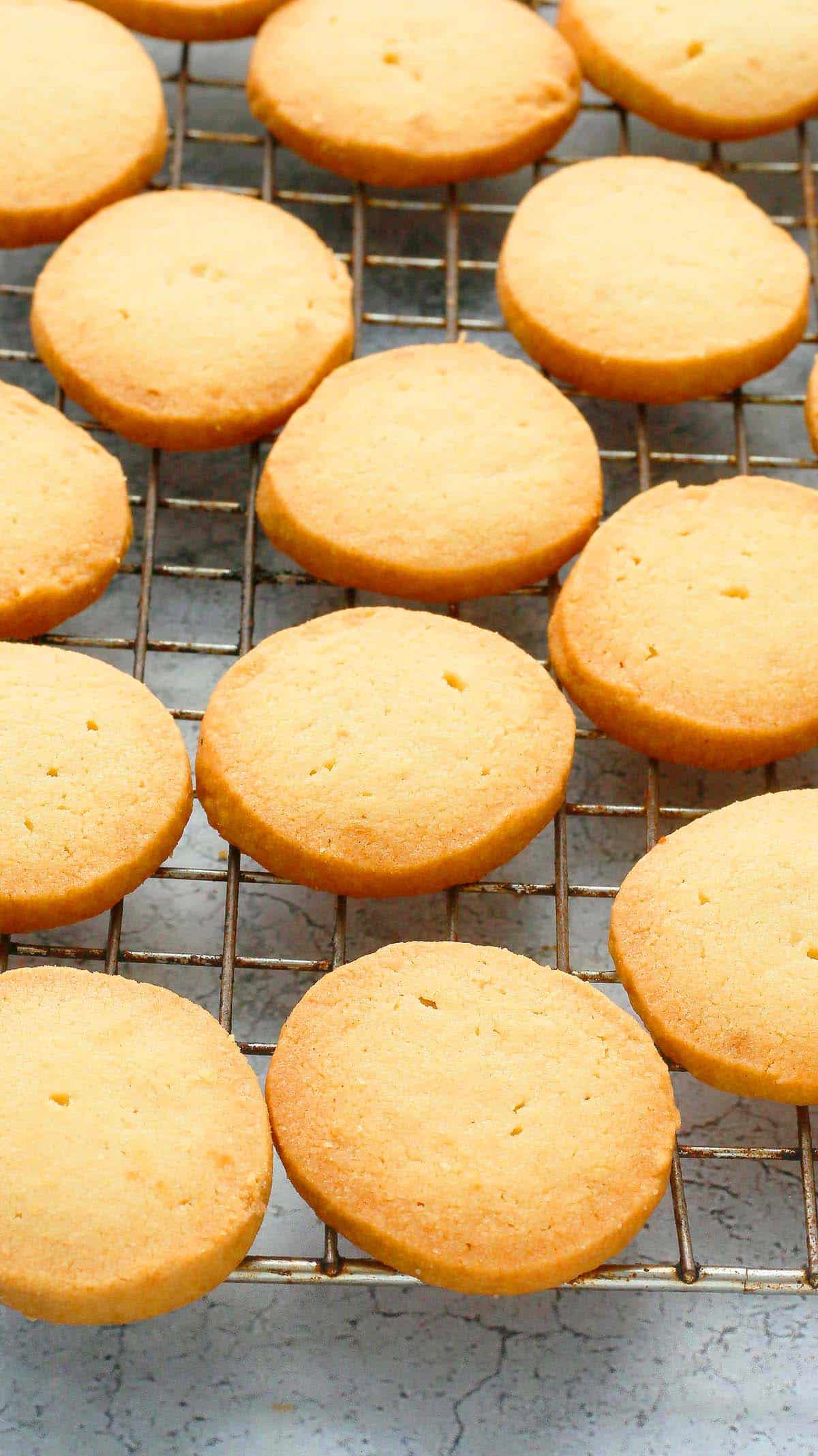 round shortbread cookies placed on a wire rack.