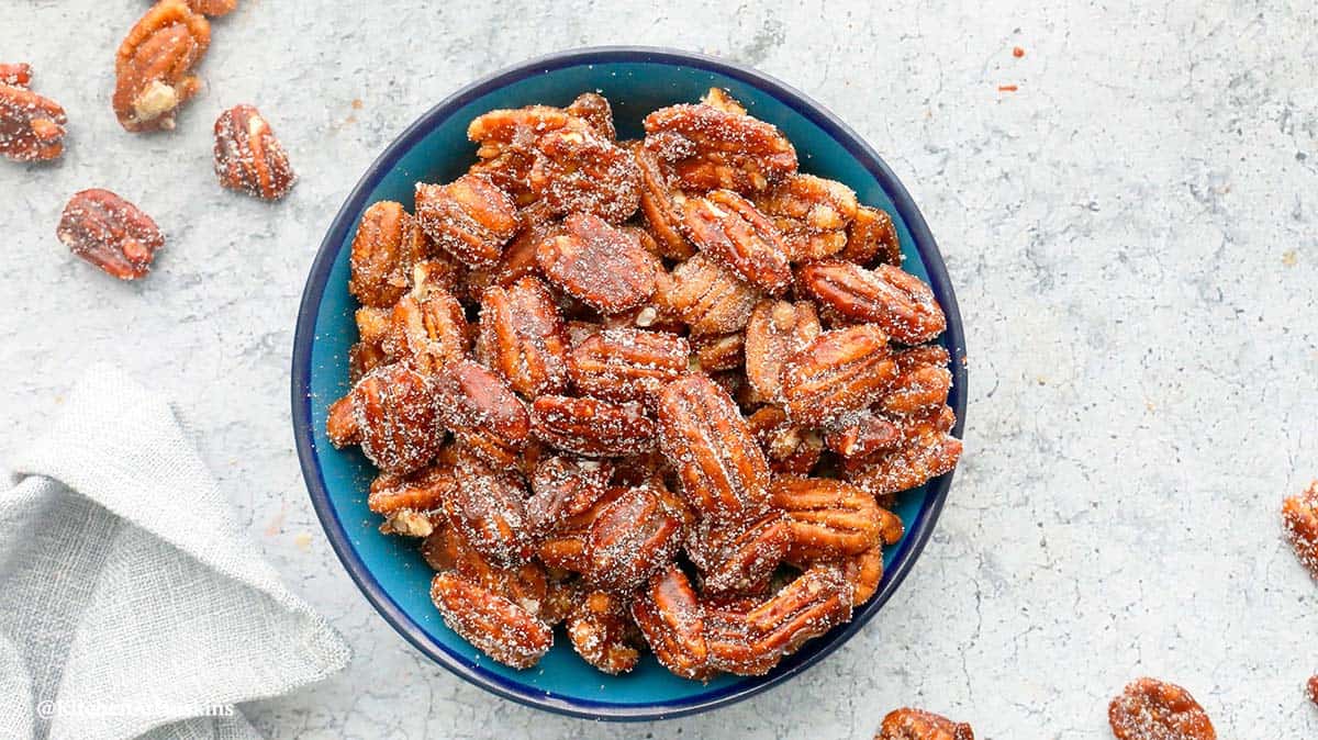 round blue bowl with skillet pecans.