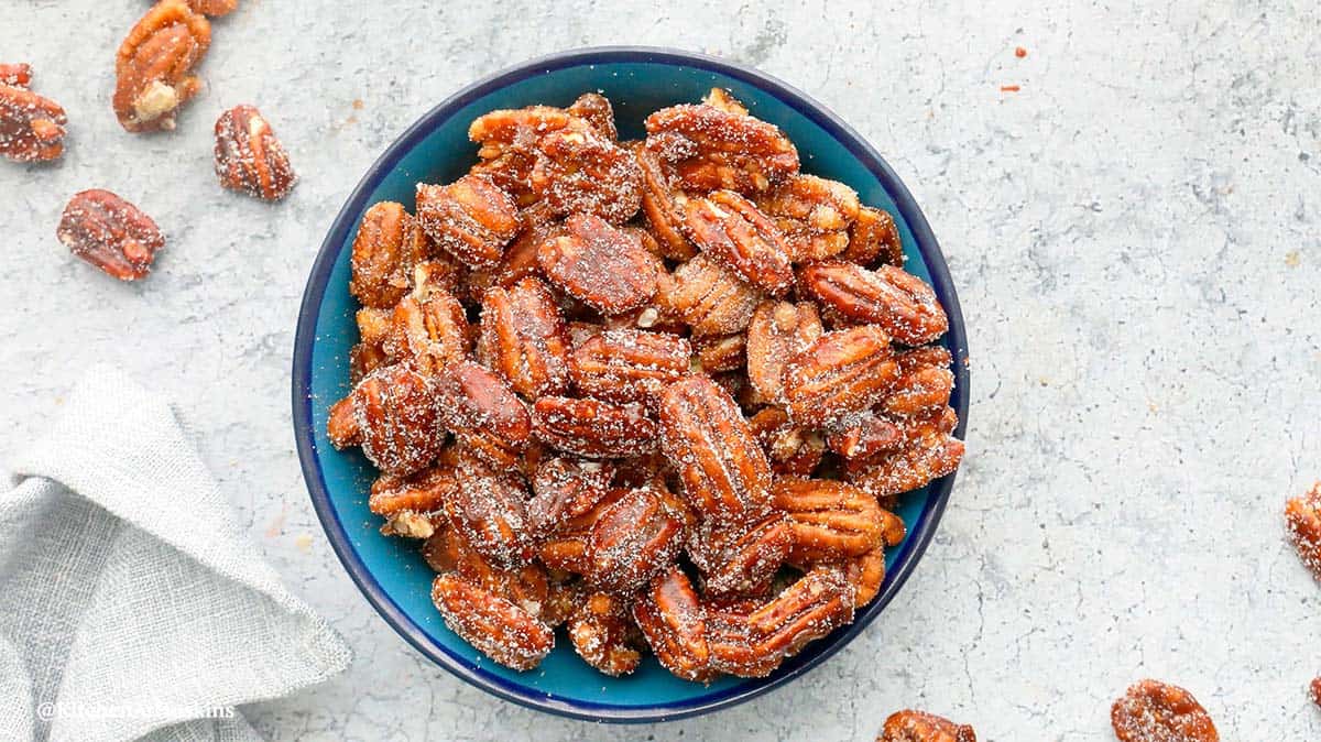 round blue bowl with candied pecans.