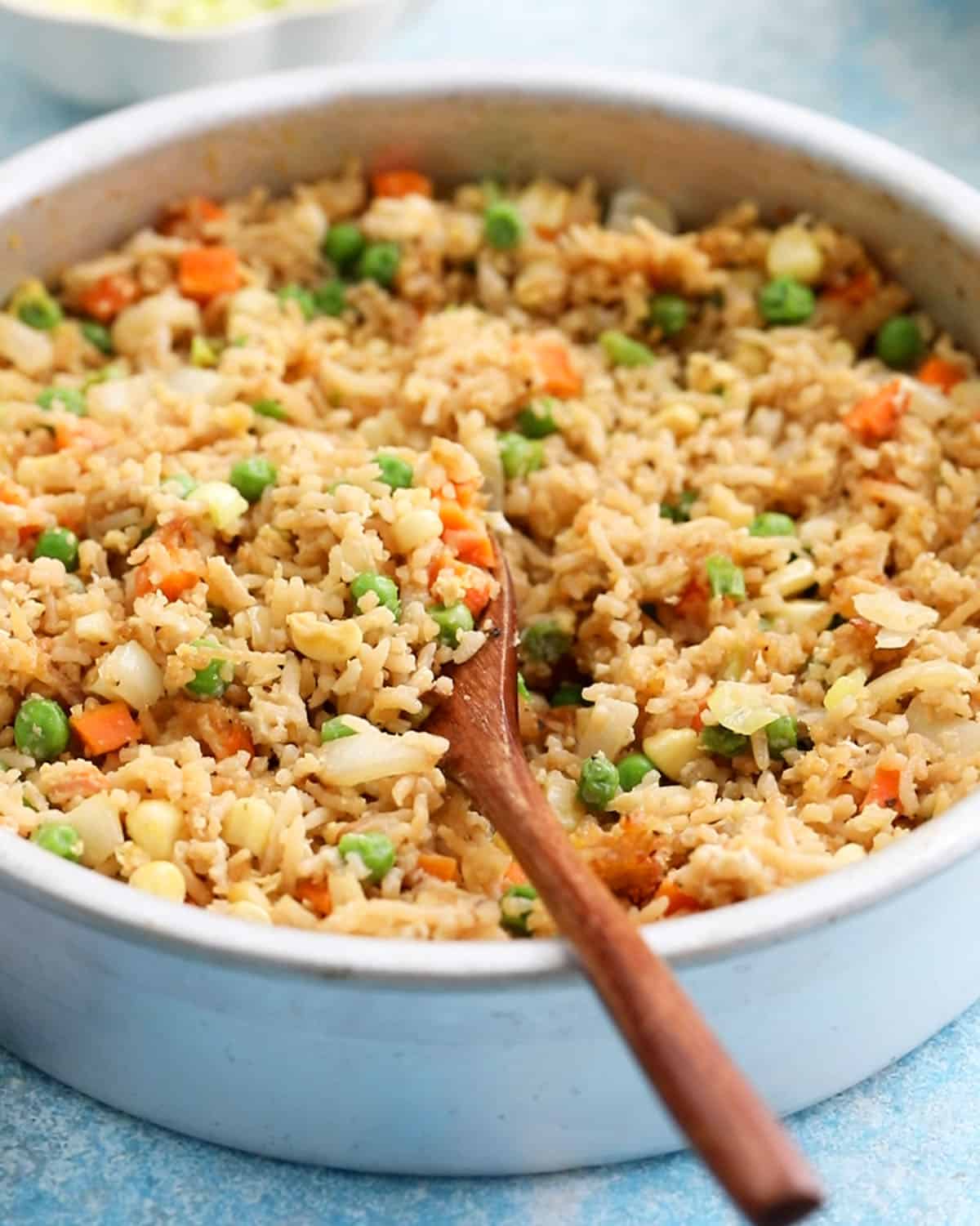 air fried rice with veggies in an round pan.