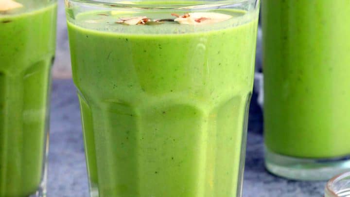 banana spinach smoothie in glasses.
