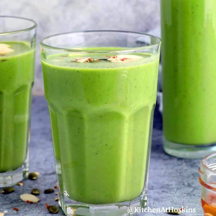 banana spinach smoothie in glasses.