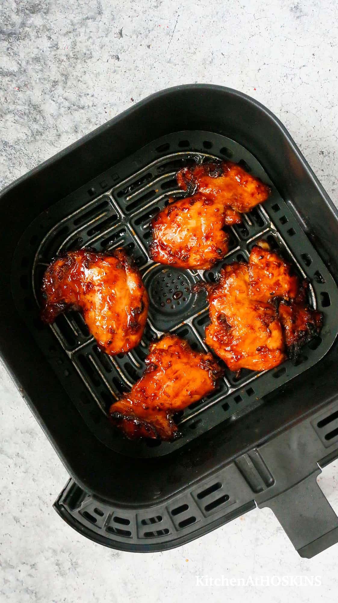 air fryer basket with boneless skinless thighs.