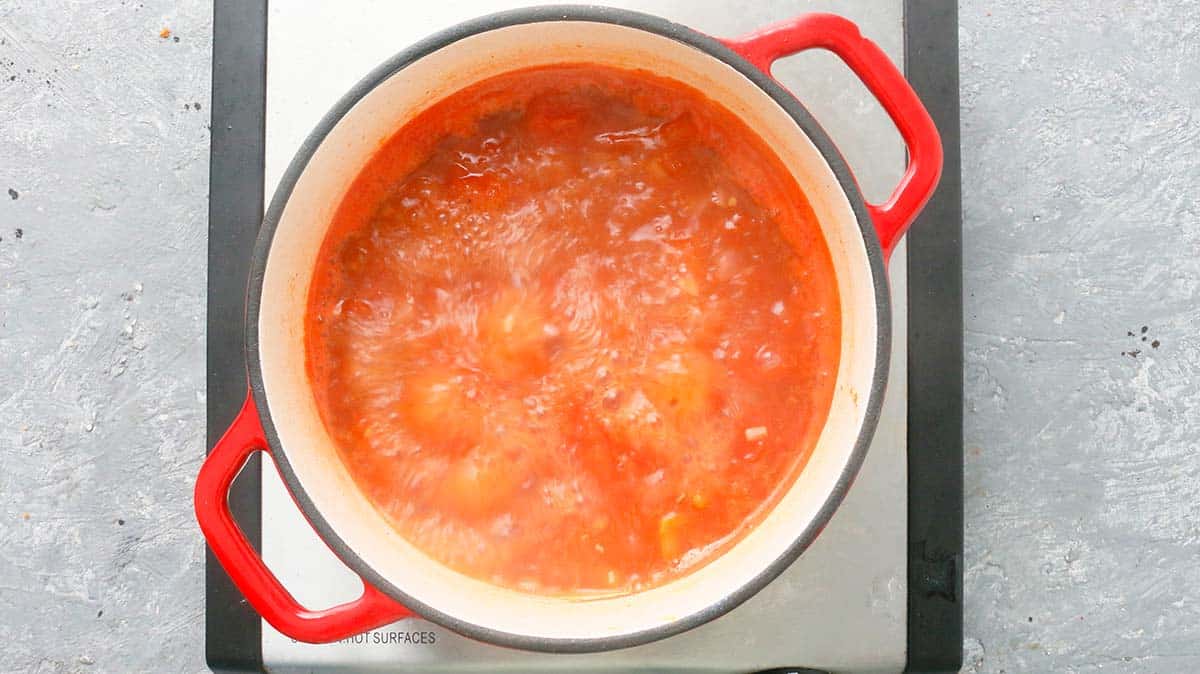 tomato soup boiling in a saucepan.