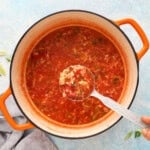 tomato egg soup in a white pan.