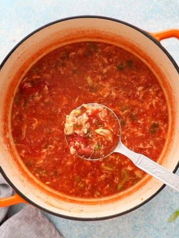 tomato egg soup in a white pan.