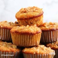 almond flour carrot muffins piled high.